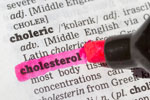 Cholesterol  highlighted in dictionary with pen closeup