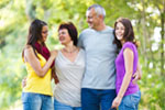 Family portrait - Family of four with a cute dog outdoors